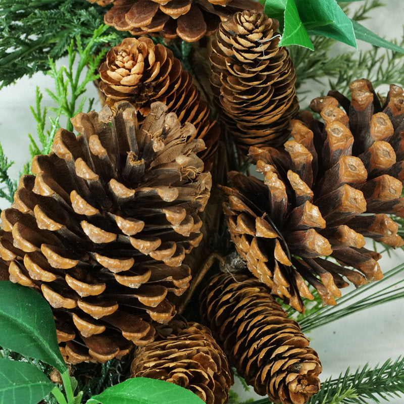 Pre-Lit Artificial Christmas Wreath hung on a wooden door