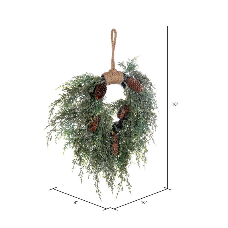 24" Pre-Lit Artificial Pine Christmas Wreath hung on a wooden door