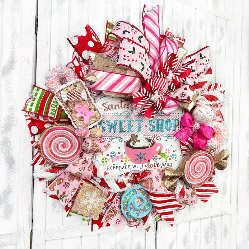 24" Artificial Christmas Wreath hanging on a front door