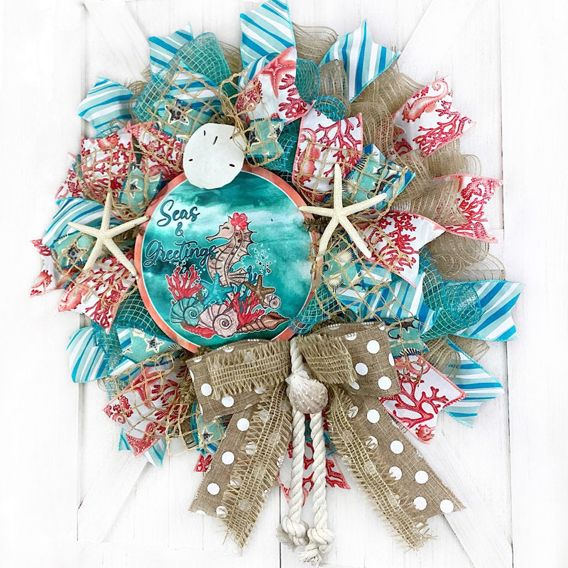 24" Pre-Lit Christmas Wreath displayed on a front door