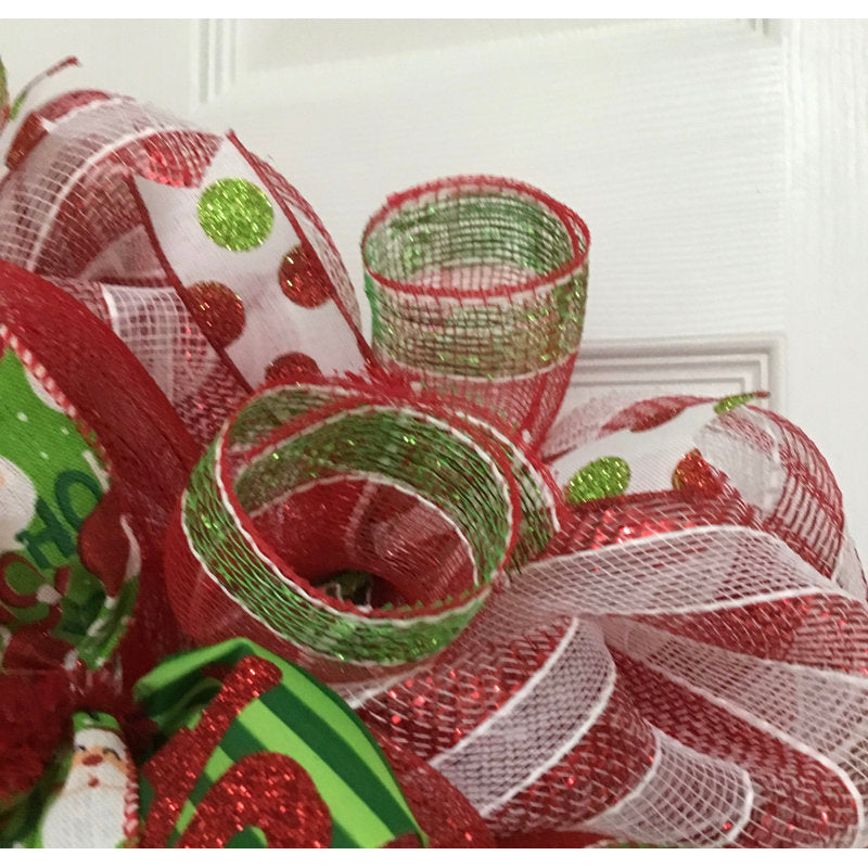 24" Pre-Lit Artificial Christmas Wreath displayed on a front door
