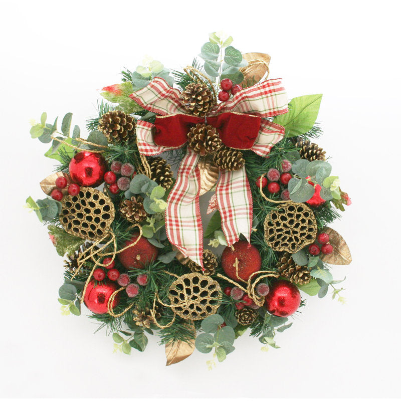 22" Artificial Eucalyptus Christmas Wreath hanging on a front door