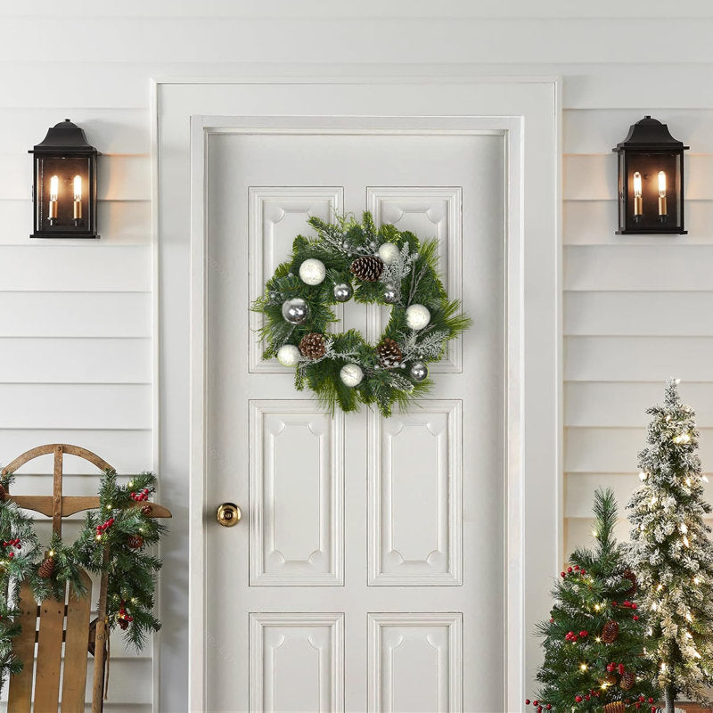10.23" Farmhouse Artificial Pine Candle Rings on a pillar candle as a table centerpiece