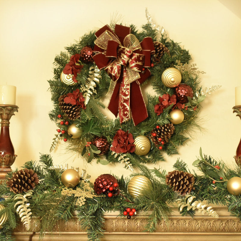 24" Artificial Christmas Wreath hung on a wooden door