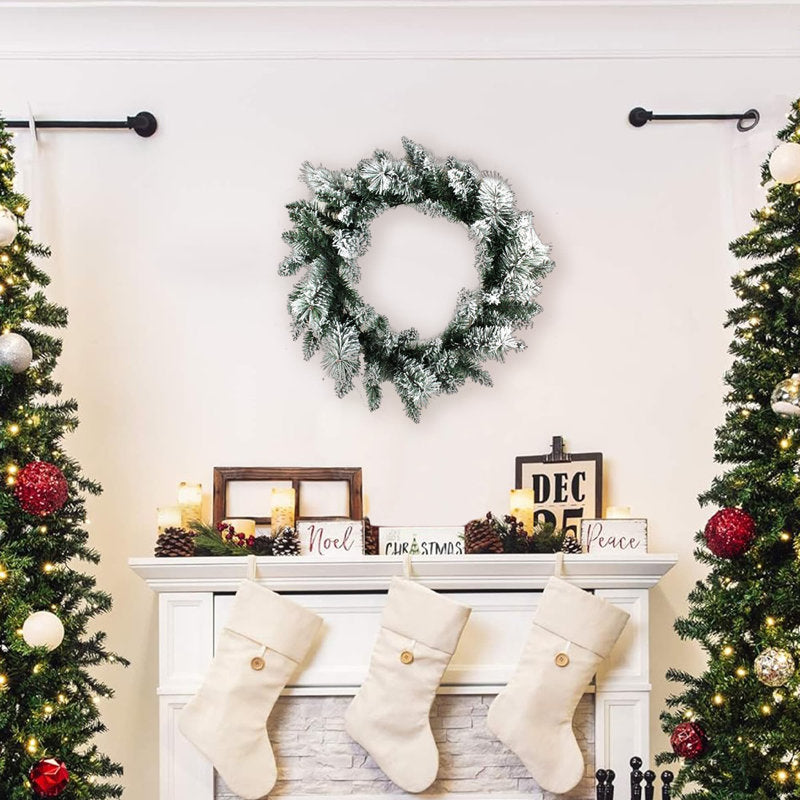 28" Artificial Pine Christmas Wreath hanging on a front door