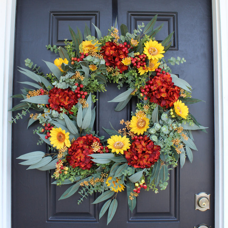 26" Eucalyptus Christmas Wreath hanging on a front door