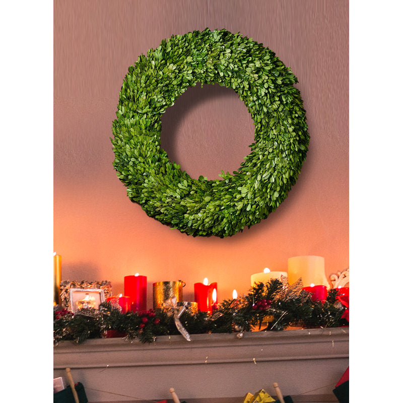 Artificial Christmas Wreath hung on a wooden door