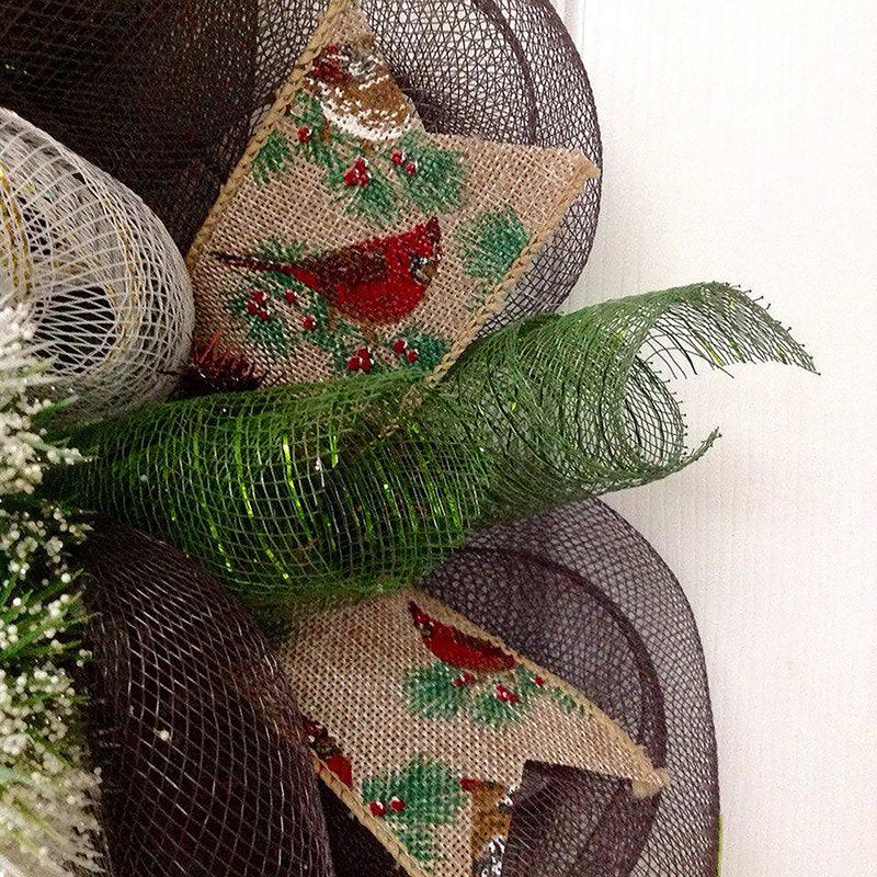 24" Pre-Lit Artificial Pine Christmas Wreath hung on a wooden door