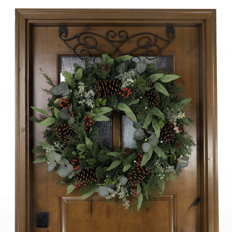 30" Pre-Lit Artificial Christmas Wreath hung on a wooden door