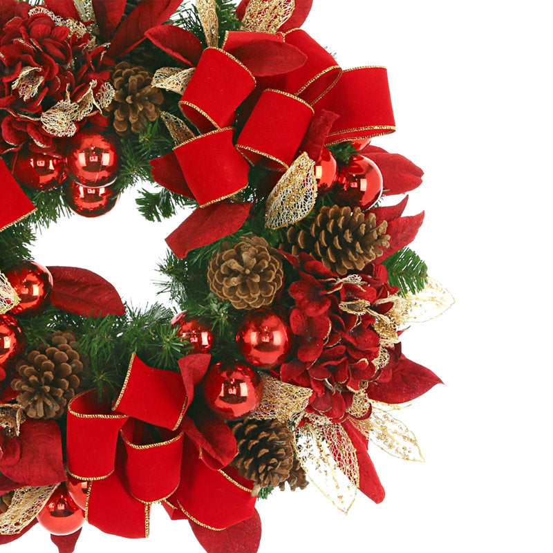 24" Pre-Lit Artificial Pine Christmas Wreath hung on a wooden door