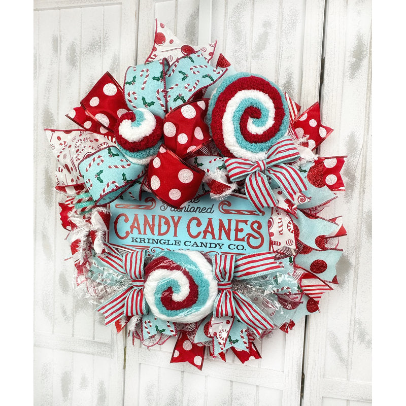 Flocked Christmas Wreath hung on a wooden door