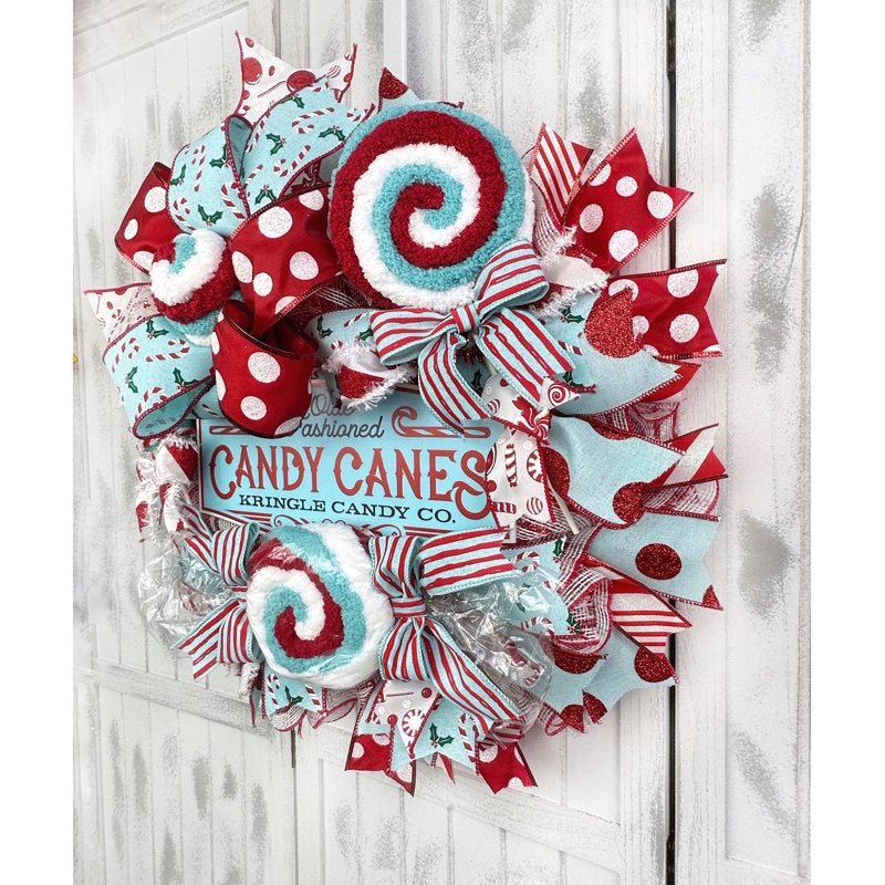Flocked Christmas Wreath hung on a wooden door