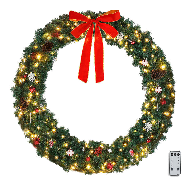 Pre-Lit Christmas Wreath hung on a wooden door