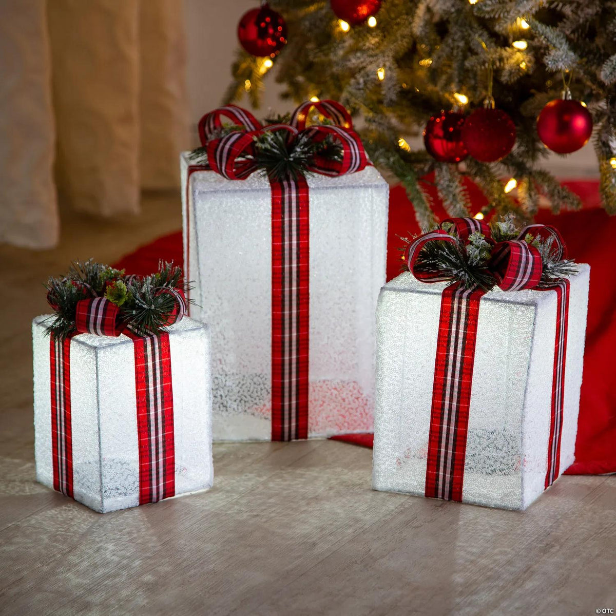 Three lighted nesting Christmas gift box yard decorations