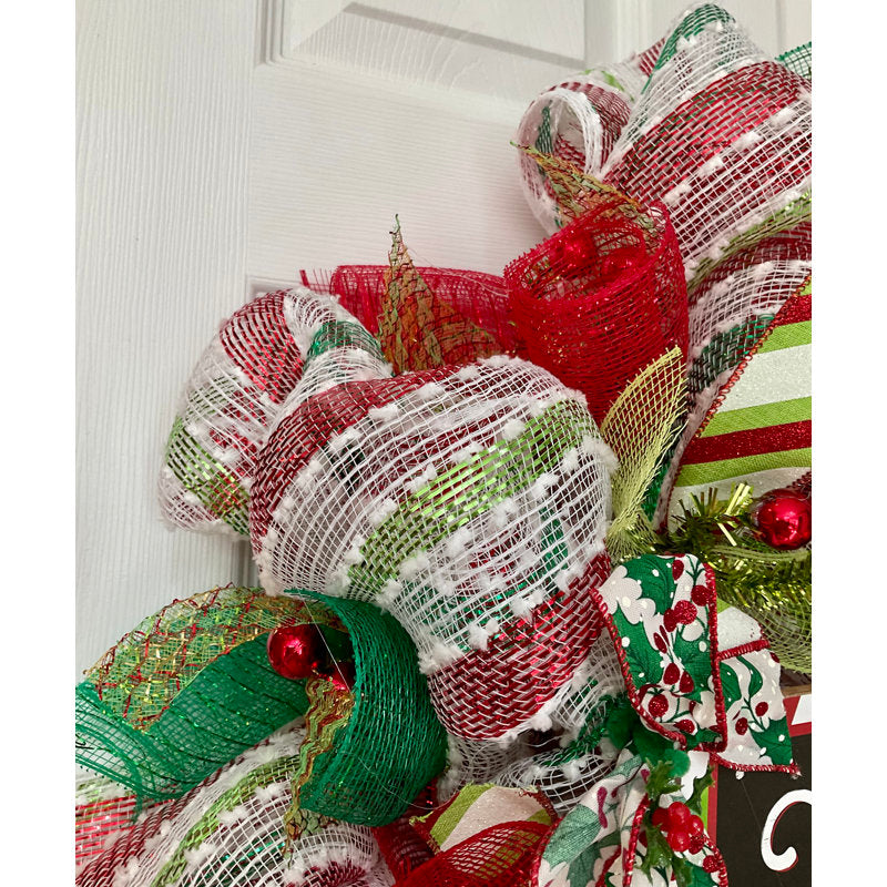 Farmhouse Berry Christmas Wreath hung on a wooden door