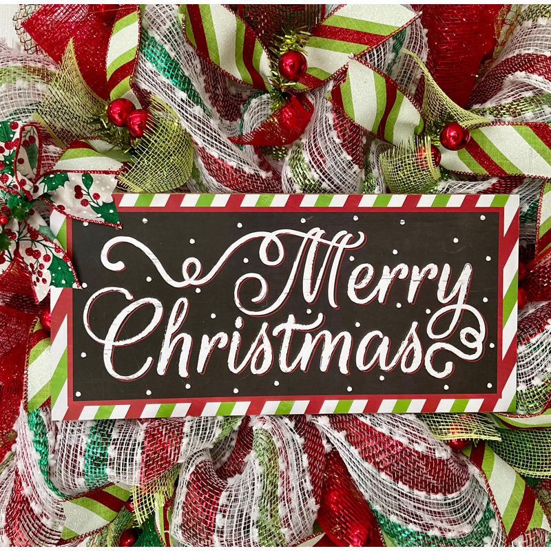 Farmhouse Berry Christmas Wreath hung on a wooden door