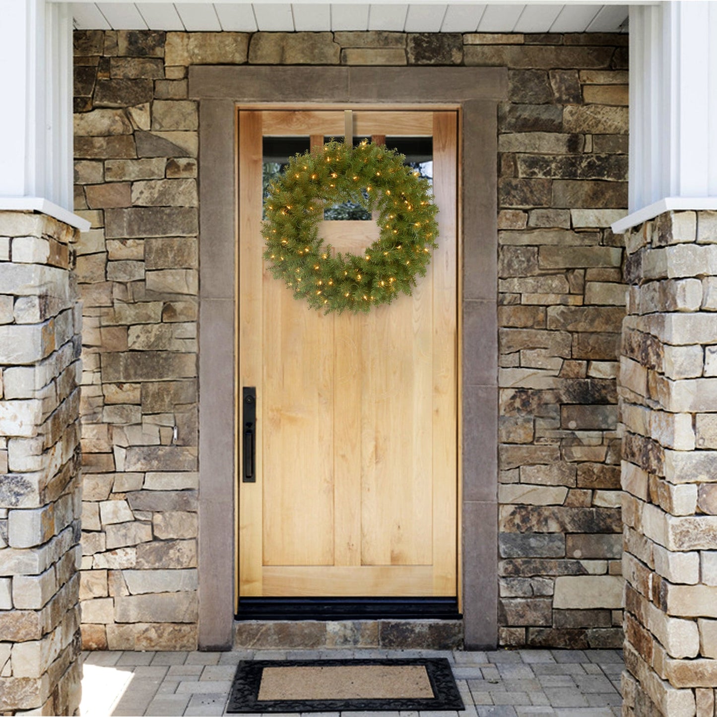 National Tree Company 24 in. Pre-Lit North Valley Spruce Wreath with Clear Lights Wall Decoration | USA Decoration®