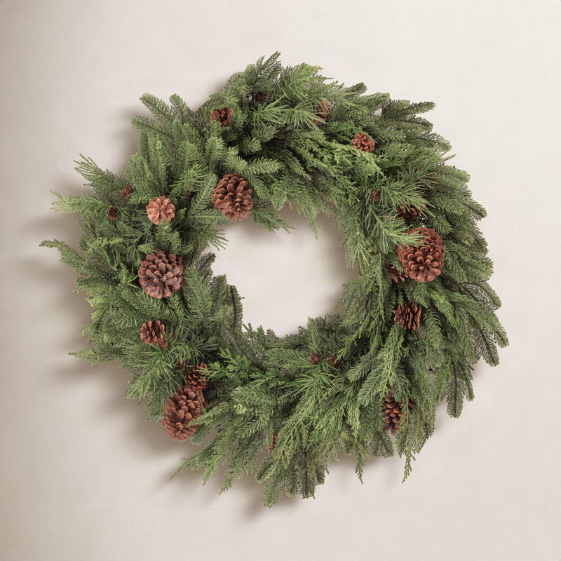 Flocked Artificial Pine Christmas Wreath hung on a wooden door