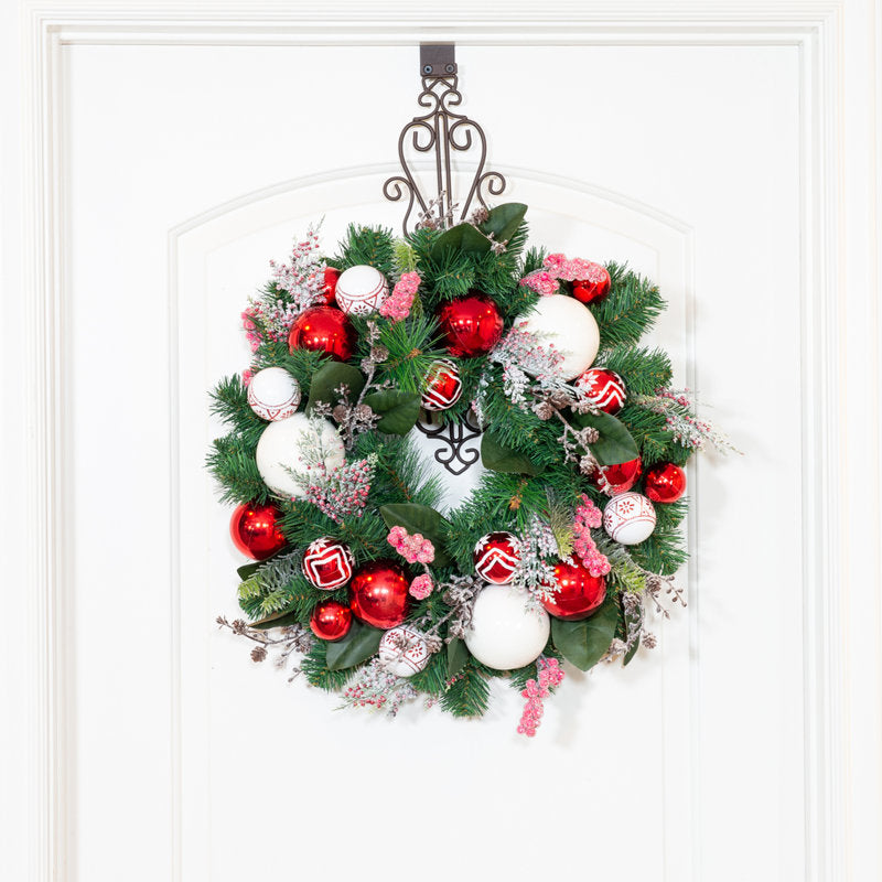 Frosted Artificial Fir Christmas Wreath hung on a wooden door