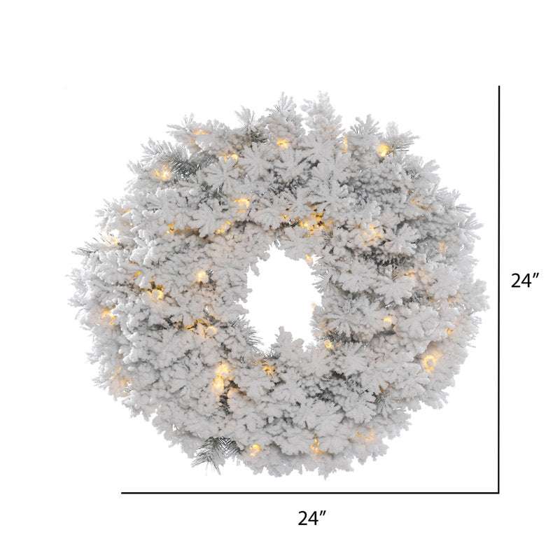Pre-Lit Artificial Christmas Wreath hung on a wooden door