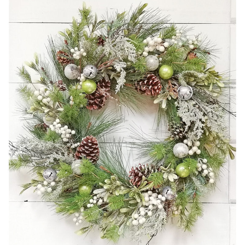 Pine Christmas Wreath hung on a wooden door