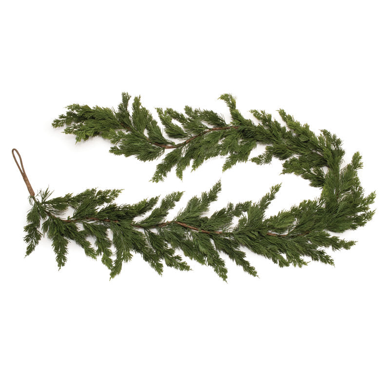 9 ft Pre-Lit Artificial Pine Christmas Garland wrapped around a staircase banister