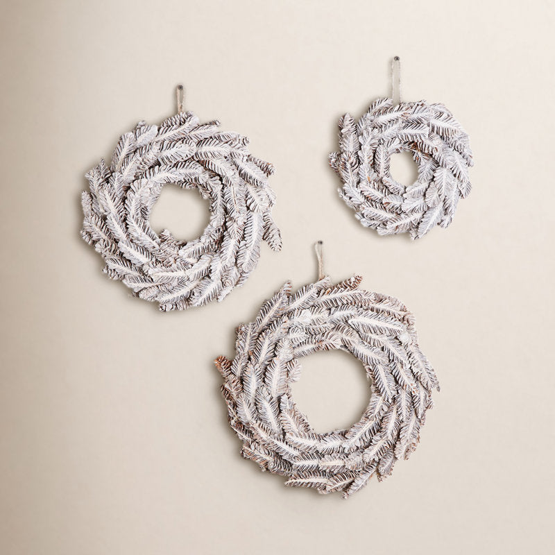 Pine Christmas Wreath hung on a wooden door