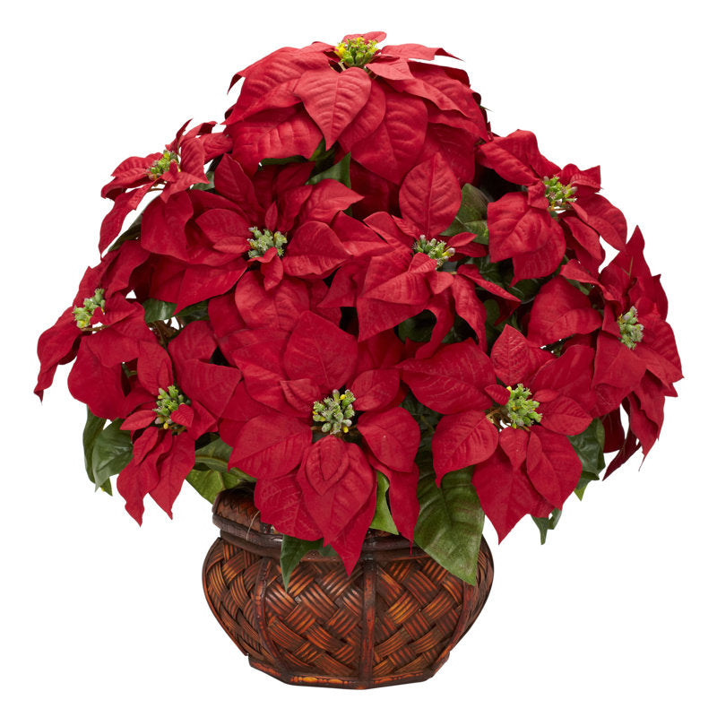Artificial poinsettia arrangement in a planter
