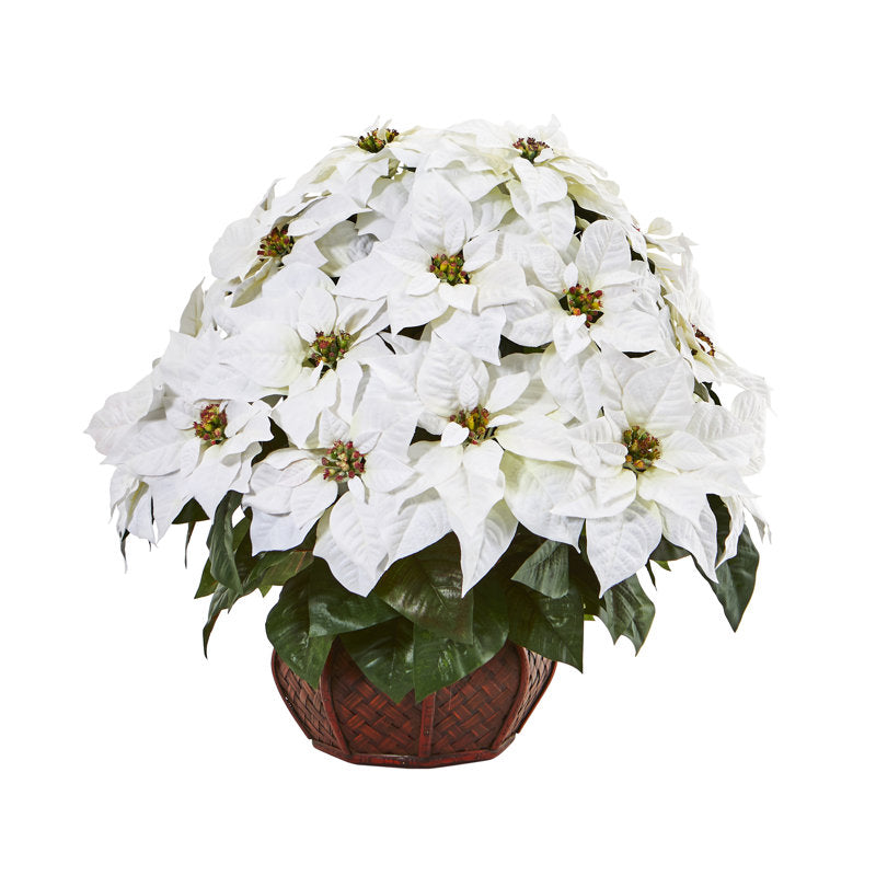 Artificial poinsettia arrangement in a planter