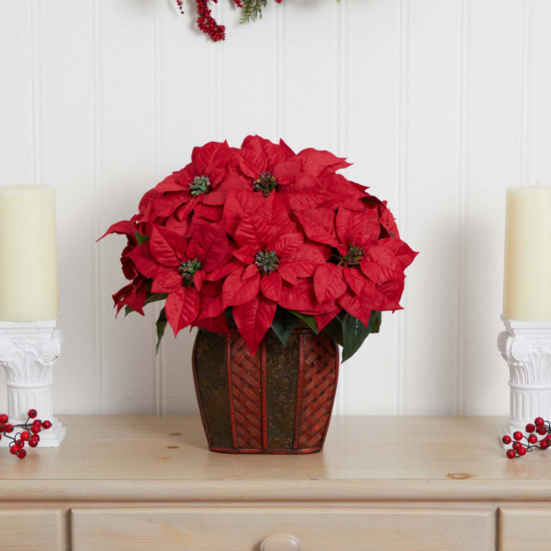 Artificial poinsettia arrangement in a vase