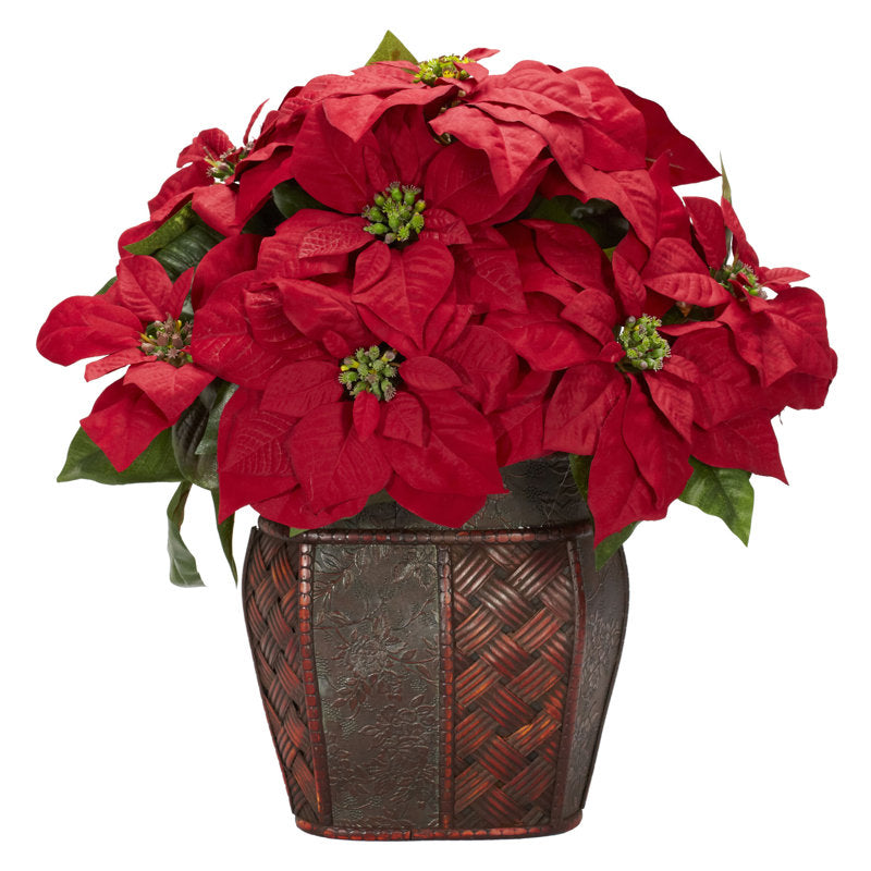 Artificial poinsettia arrangement in a vase