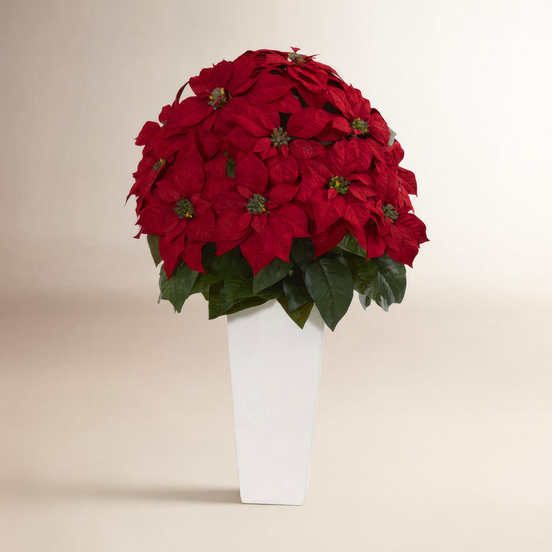 Poinsettia floral arrangement in a planter