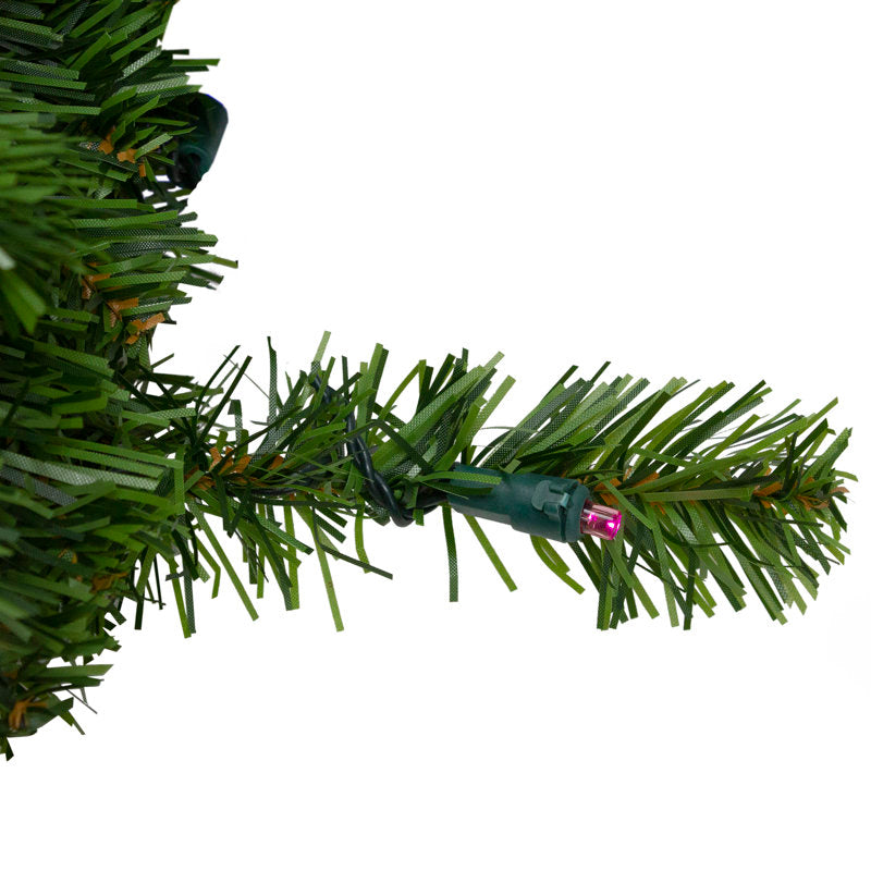 Frosted Artificial Pine Christmas Wreath displayed on a front door