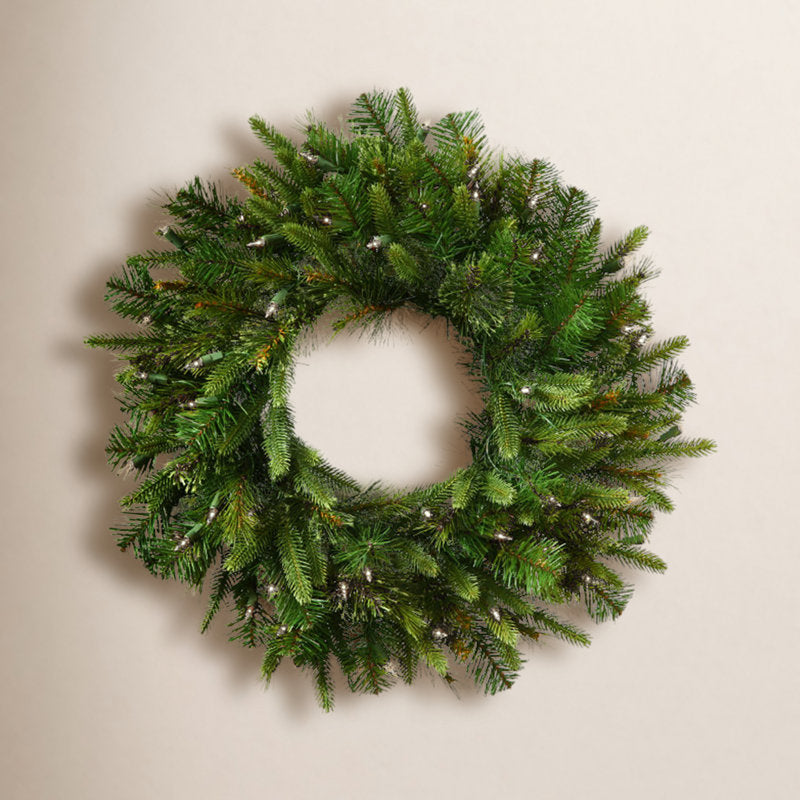 Pre-Lit Artificial Pine Christmas Wreath hung on a wooden door