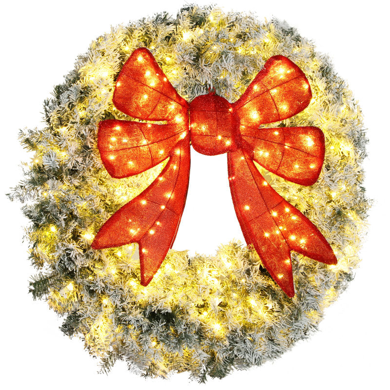 Flocked Christmas wreath with a bow