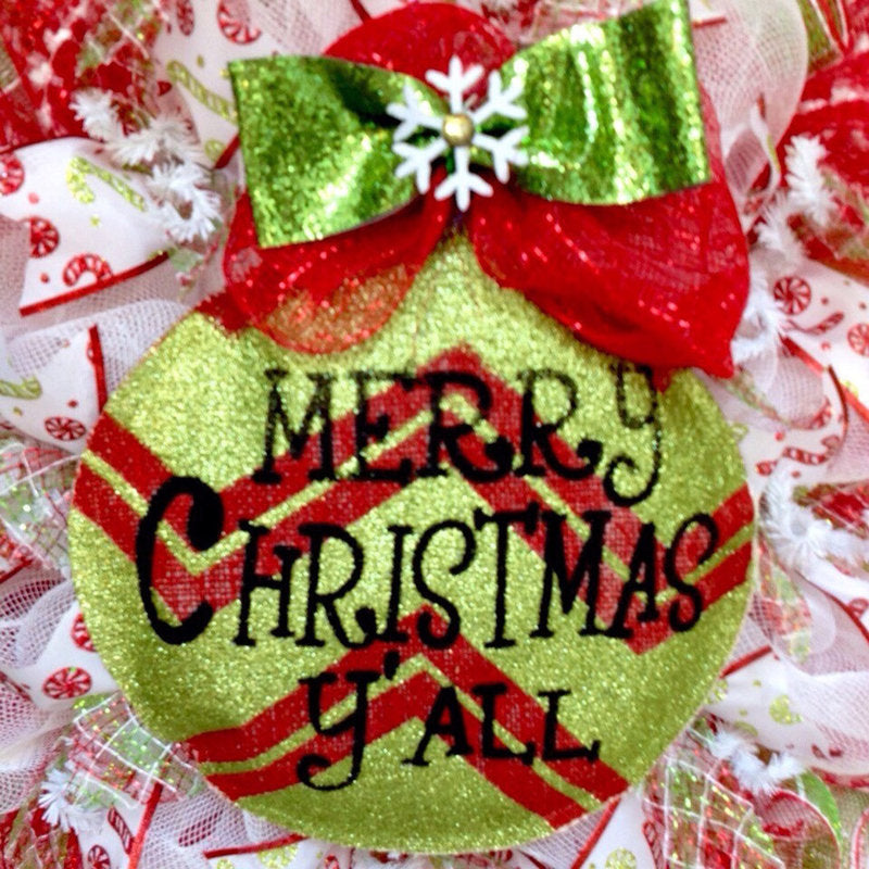 20" Pre-Lit Artificial Spruce Christmas Wreath hung on a wooden door