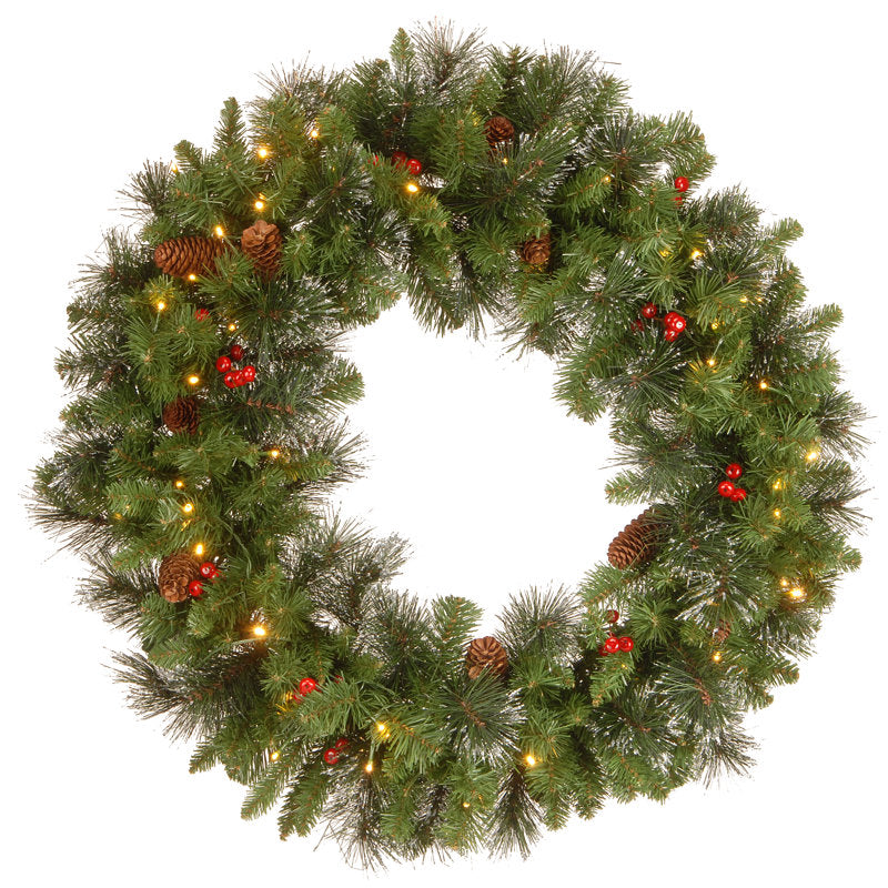 Pre-Lit Spruce Christmas Wreath hanging on a front door
