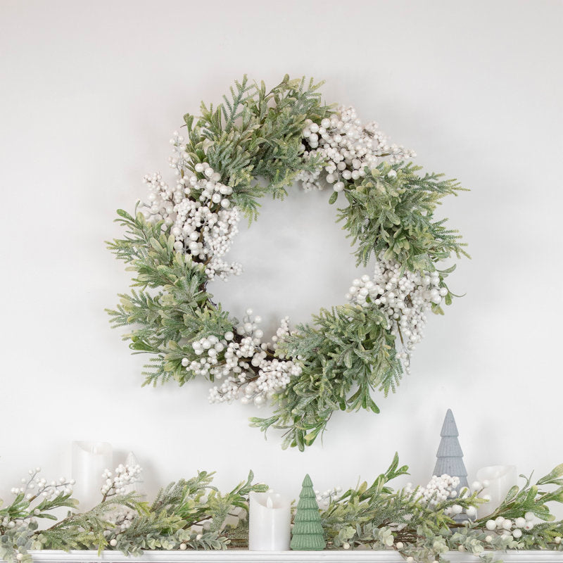 28" Berry Christmas Wreath hung on a wooden door