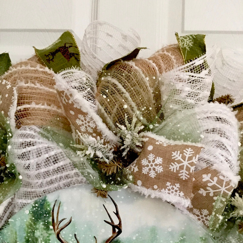 24" Pre-Lit Pine Christmas Wreath displayed on a front door