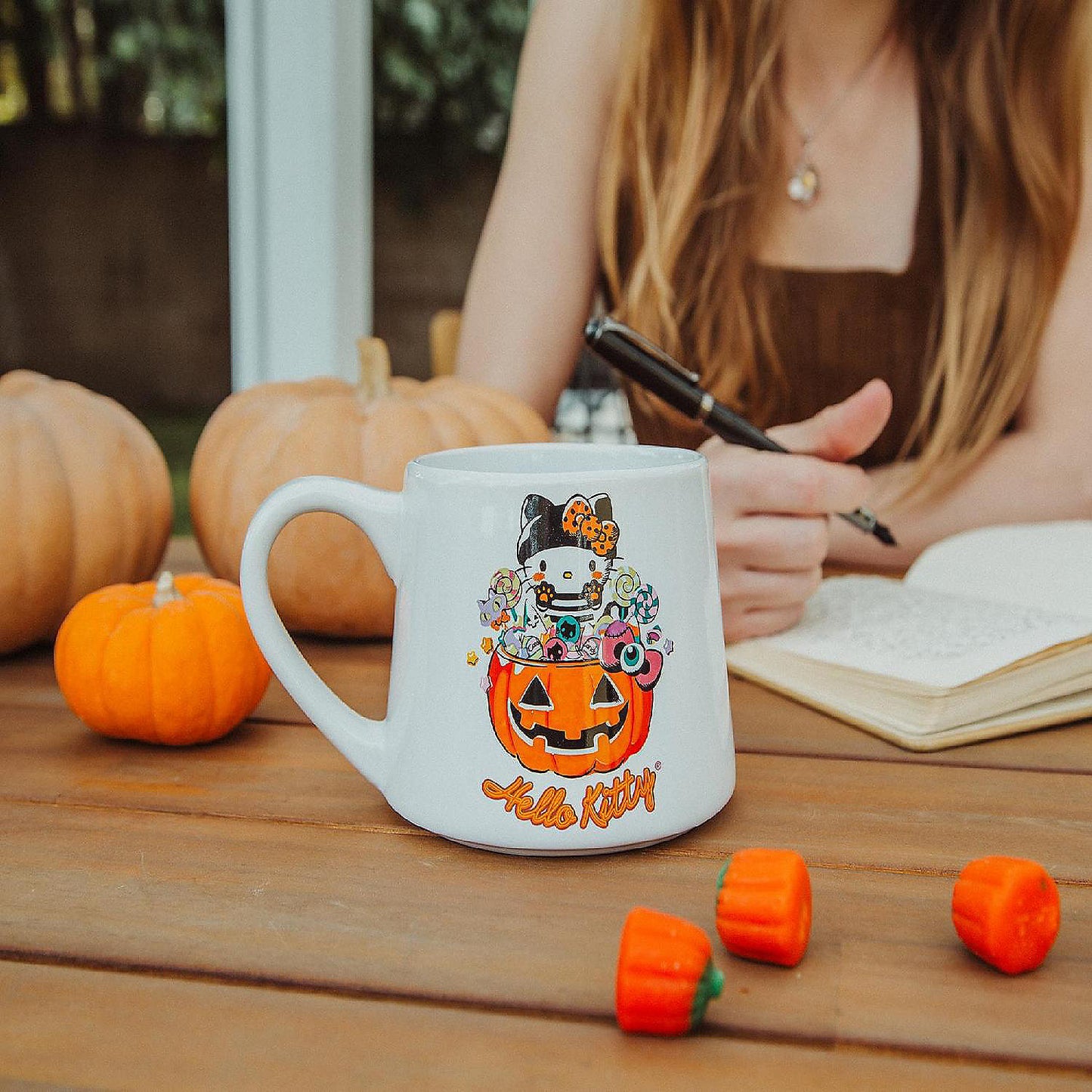 Sanrio Hello Kitty Pumpkin Candy Burglar Tapered Pottery Mug Holds 14 Ounces | USA Decoration®